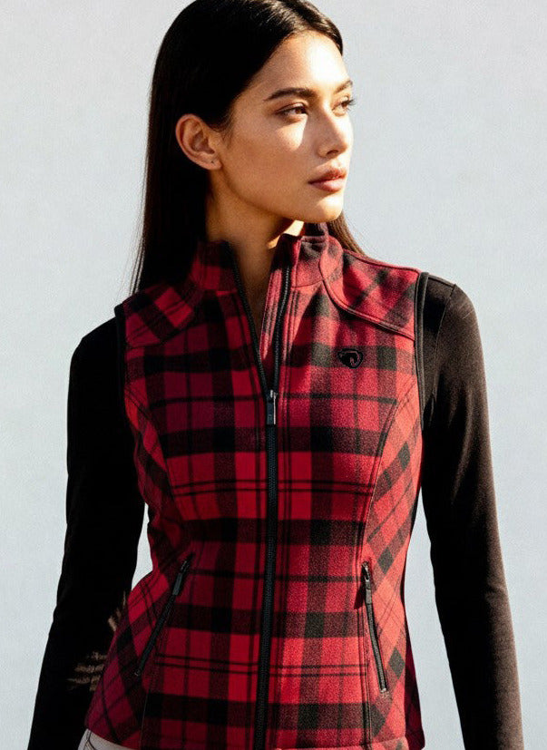 Woman wearing a red and black plaid vest against a light background